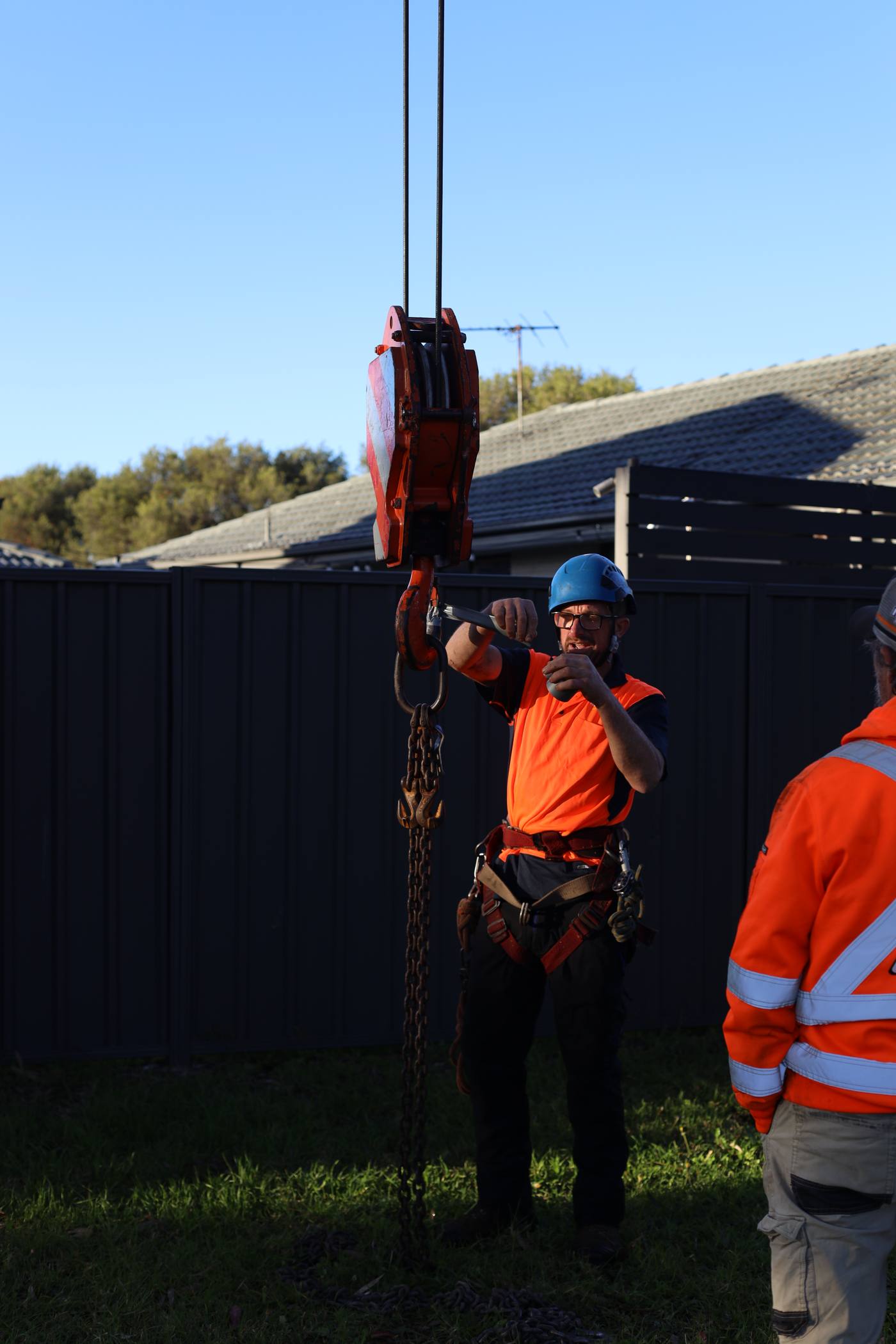 Rigging and crane hook being set for a controlled removal